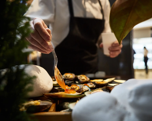 Luxury Dining in SG : Guests enjoying an intimate chef’s table experience in a fine dining restaurant
