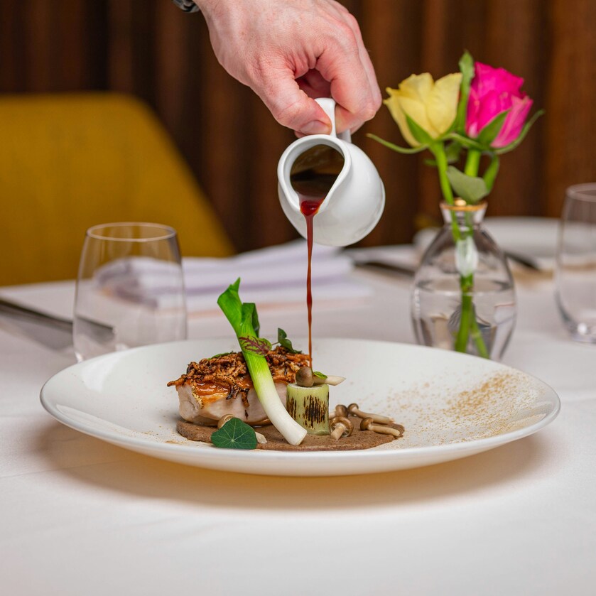 Luxury Dining in SG : Chef preparing a signature tasting menu for an intimate dining experience