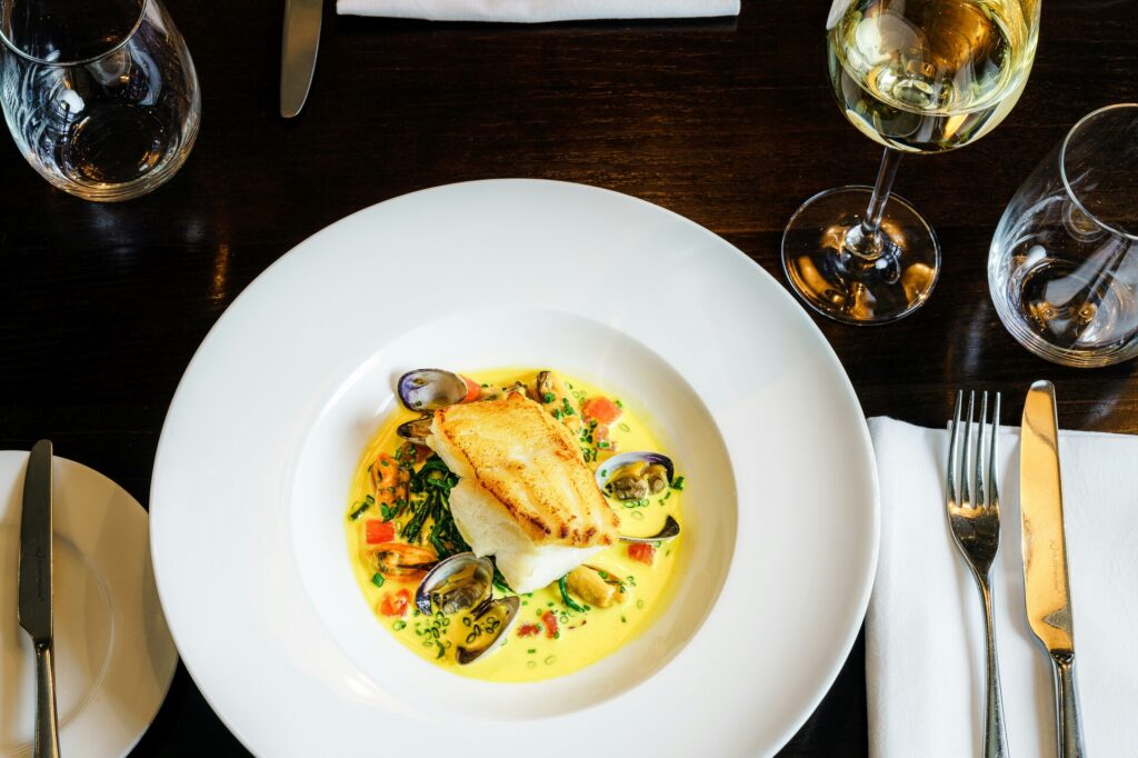 Luxury Dining in SG : Close-up of gourmet dishes showcasing culinary artistry and seasonal ingredients