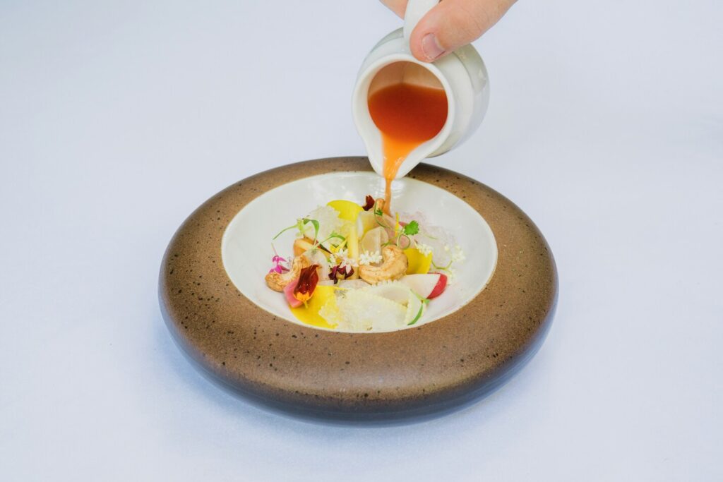 Fusion Cuisine in Singapore : Singaporean chefs reimagining classic dishes with global culinary creativity.