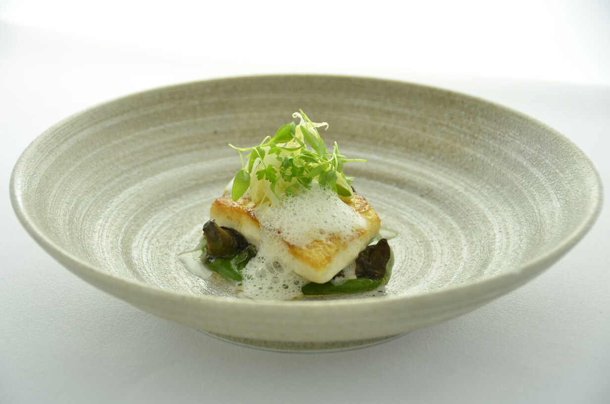 Luxury Dining in SG : Patrons enjoying an exclusive multi-course dining experience