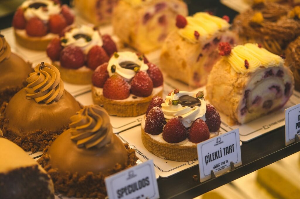 An assortment of cakes beautifully arranged, highlighting desserts and snacks for a perfect nightcap in Singapore.