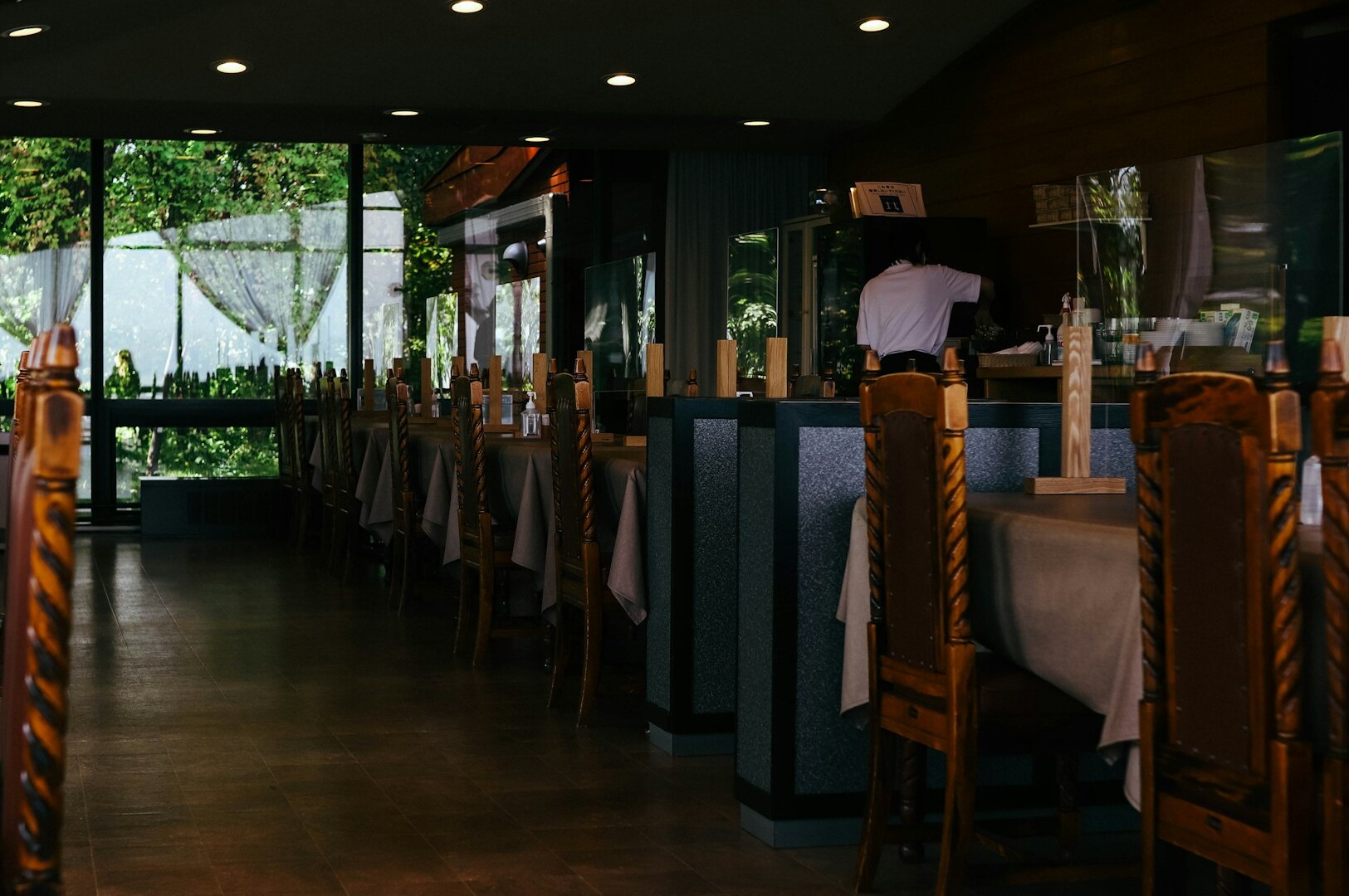 Interior of a restaurant showcasing a long table, designed for upscale dining experiences in Singapore's Michelin-starred scene.