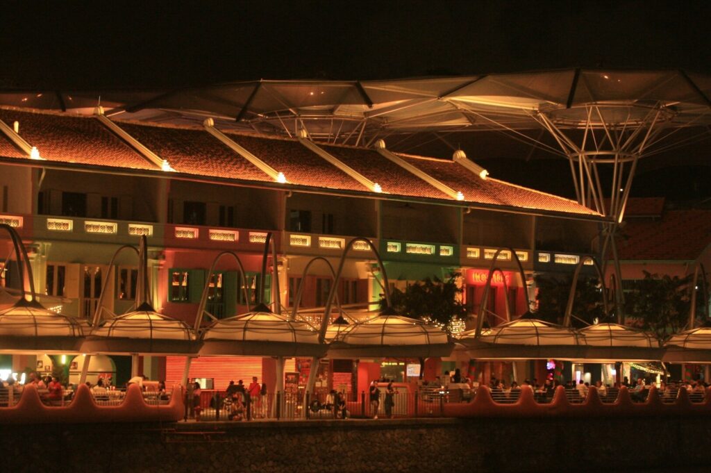 A stunningly illuminated building representing the distinctive Michelin scene in Singapore's nightlife.