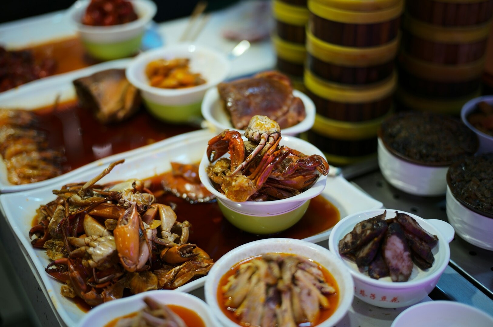 A colorful array of dishes displayed in bowls, showcasing the diverse food culture of Singapore.