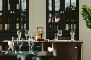 Interior of an elegant Singapore restaurant showcasing a table and chairs arranged for guests.