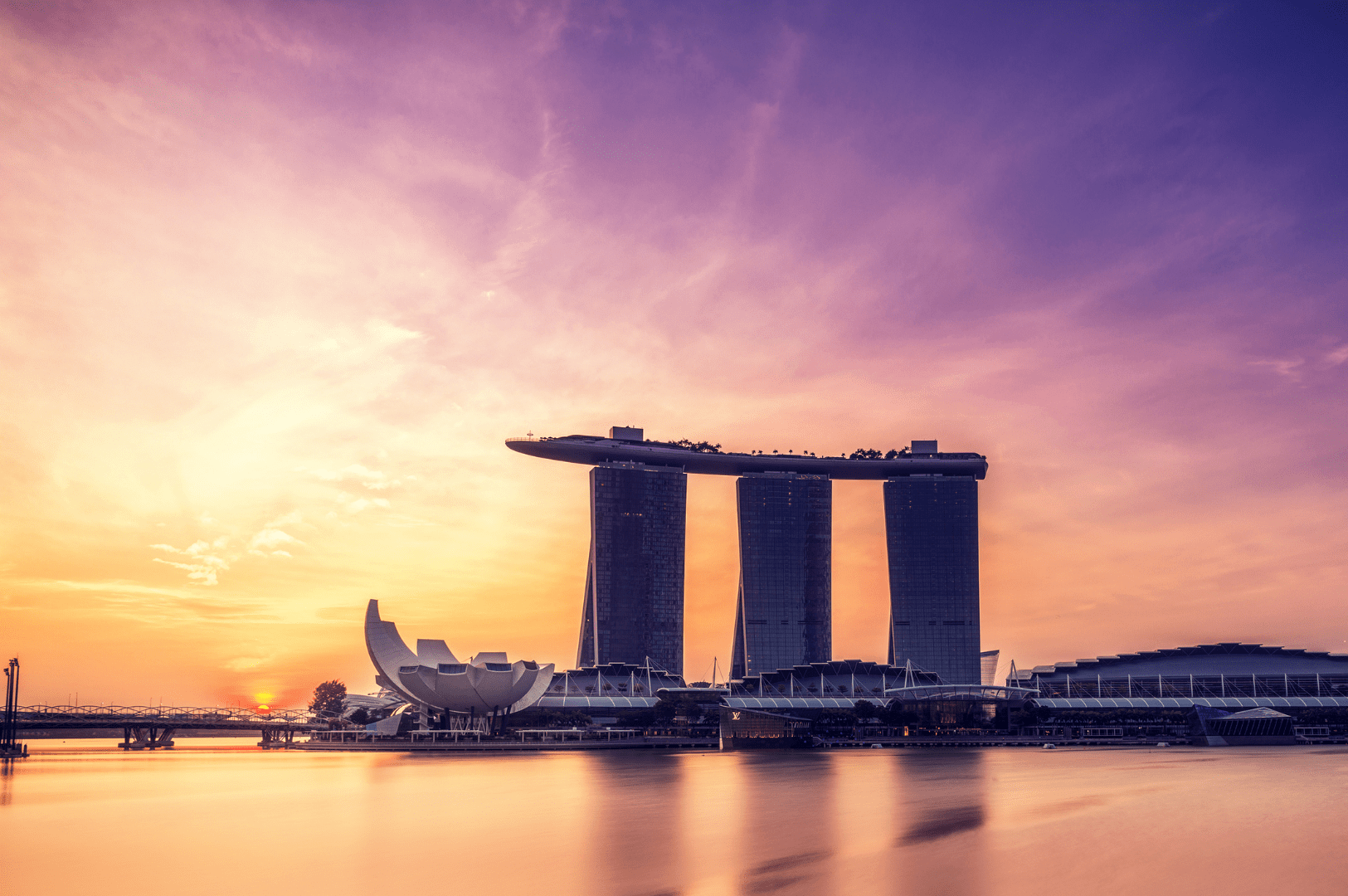 Luxury dining experience overlooking Marina Bay Sands at sunset, with panoramic views of Marina Bay, Marina Bay Financial Centre, and the iconic Singapore skyline. Located in the heart of the Marina Bay area near Downtown Singapore, Sentosa Island, Mount Faber Peak, Ocean Financial Centre, Customs House, Collyer Quay, Civic District, Raffles Place, and OUE Bayfront—this cityscape captures the elegance and vibrancy of Singapore.