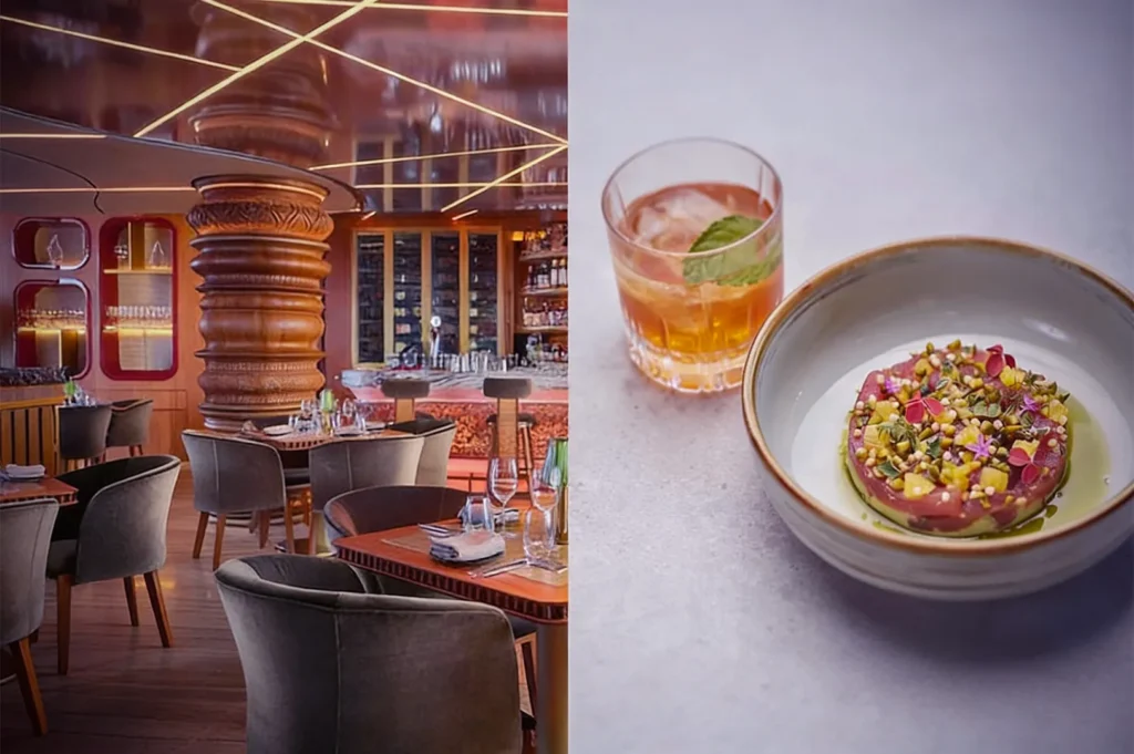 A modern, elegant restaurant interior with soft lighting and plush seating on the left. On the right, a gourmet dish with colorful toppings beside a cocktail.
