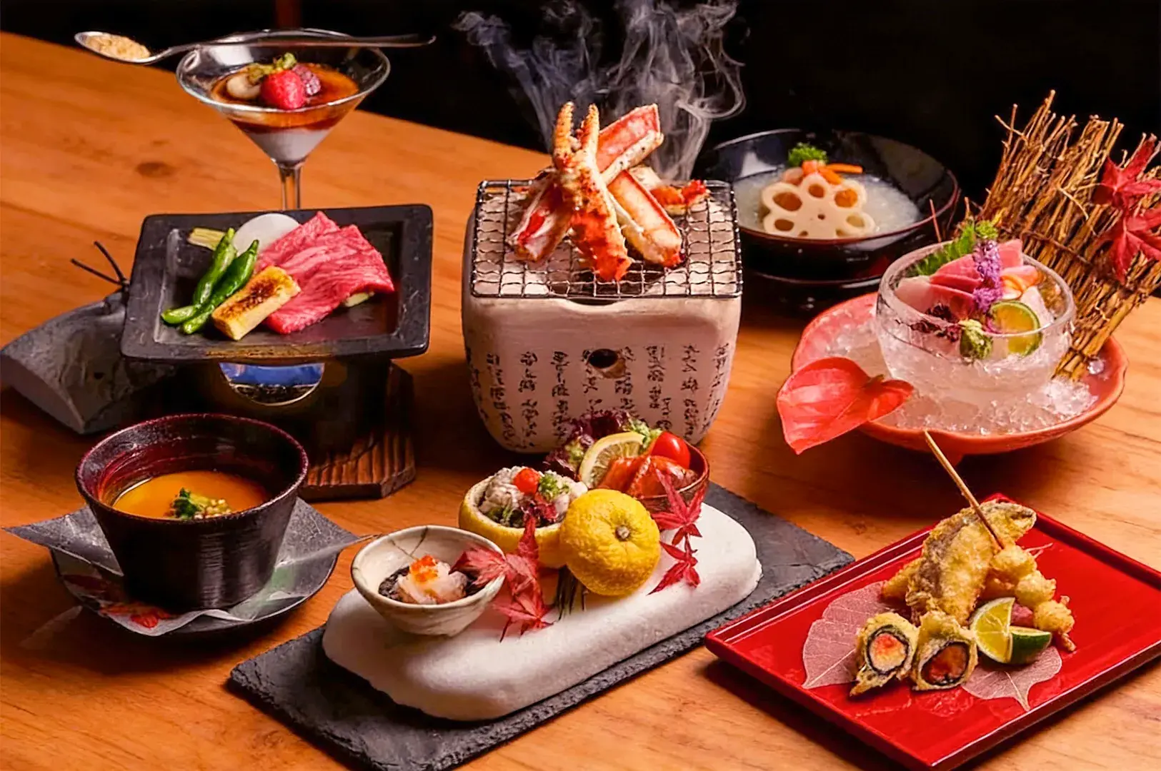 An elegant Japanese meal on a wooden table, featuring grilled crab, sashimi on ice, tempura, and a variety of colorful, artfully arranged dishes.