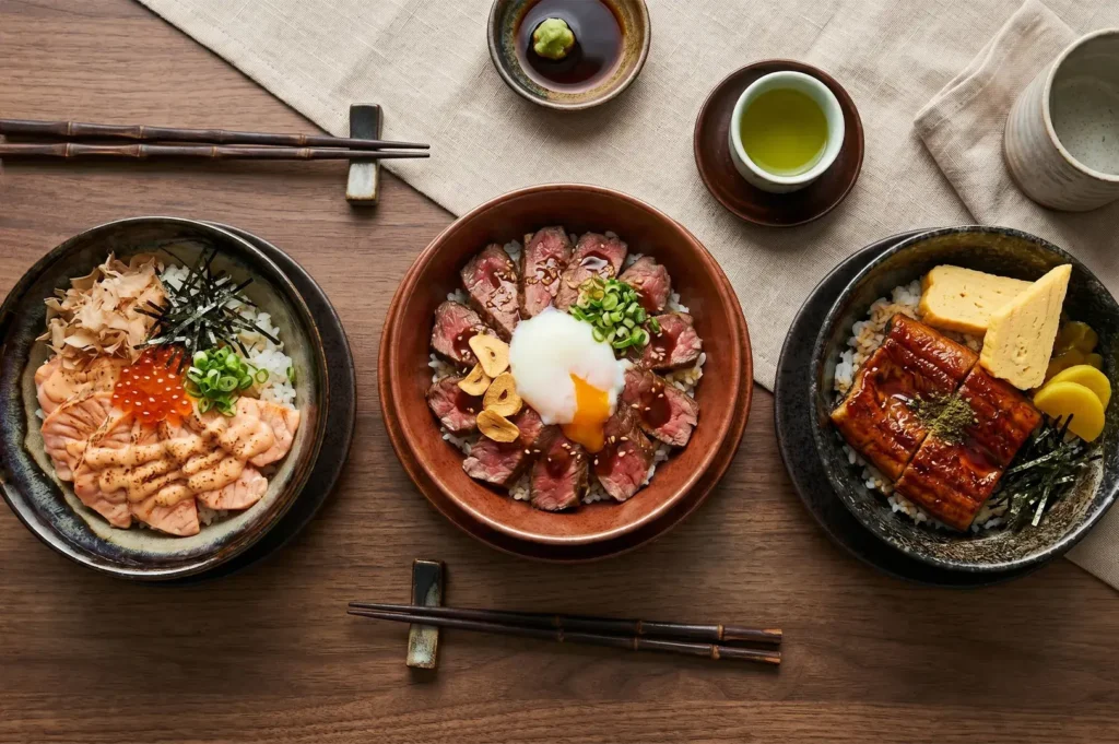 Assorted Japanese Donburi rice bowls with wagyu beef, salmon mentaiko, and unagi eel.